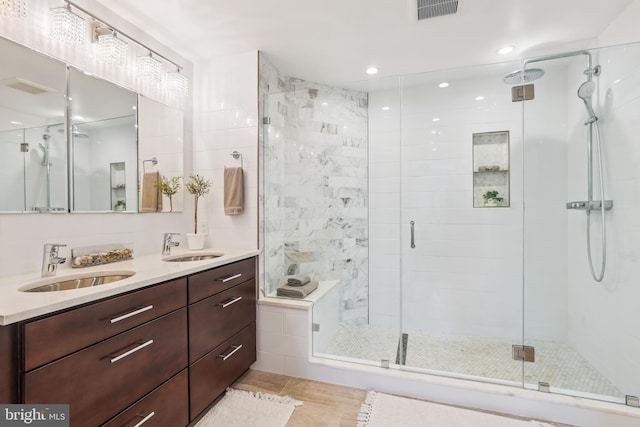 4410 S Pershing Ct, Arlington, VA 22204 - bathroom featuring a shower stall, double vanity, and tile patterned floors
