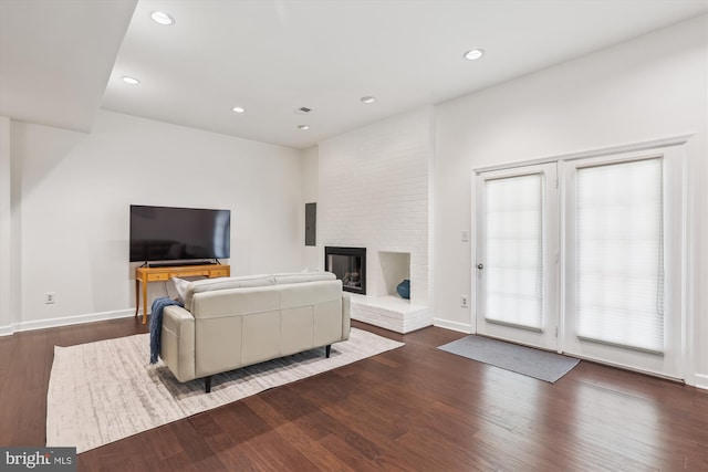 4410 S Pershing Ct, Arlington, VA 22204 - living room featuring wood finished floors, a fireplace, recessed lighting, and baseboards