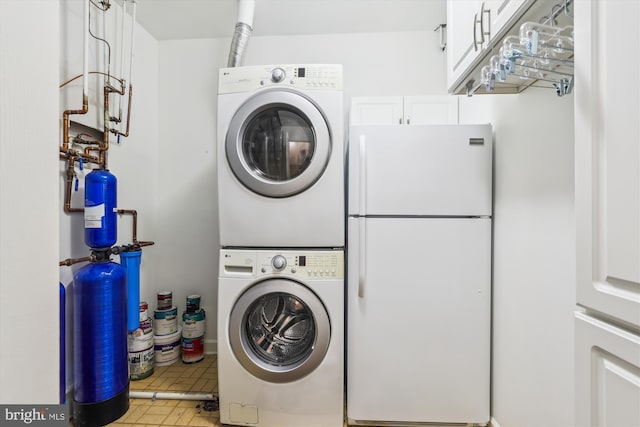 4410 S Pershing Ct, Arlington, VA 22204 - washroom with stacked washer and clothes dryer and cabinet space