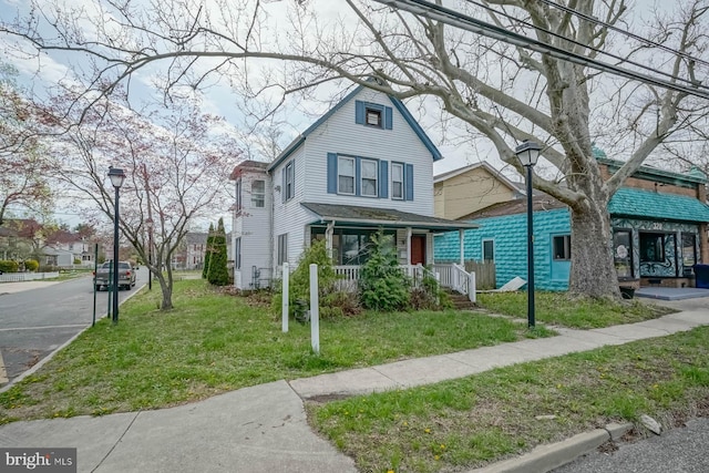 318 12th St, Hammonton, NJ 08037 - view of front of house with covered porch and a front yard