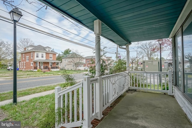 318 12th St, Hammonton, NJ 08037 - covered porch featuring a residential view