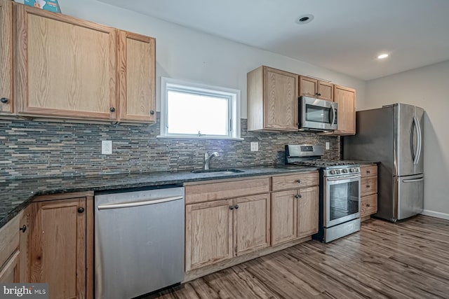 318 12th St, Hammonton, NJ 08037 - kitchen featuring appliances with stainless steel finishes, a sink, light brown cabinetry, wood finished floors, and recessed lighting
