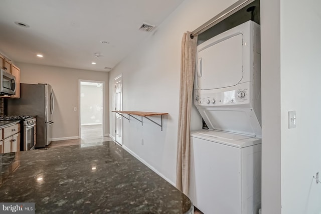 318 12th St, Hammonton, NJ 08037 - laundry room featuring stacked washer and clothes dryer, recessed lighting, and baseboards