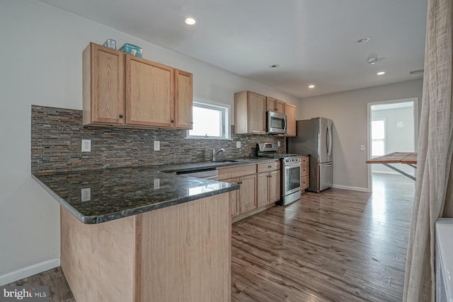 318 12th St, Hammonton, NJ 08037 - kitchen featuring appliances with stainless steel finishes, light brown cabinets, a sink, a peninsula, and recessed lighting