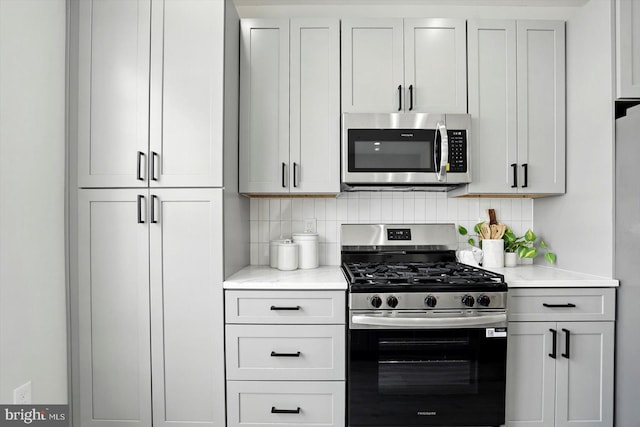 7710 Village Park Dr, Baltimore, MD 21222 - kitchen with stainless steel appliances, tasteful backsplash, and light stone countertops