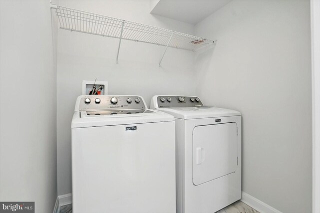 7710 Village Park Dr, Baltimore, MD 21222 - laundry room featuring washer and dryer and baseboards