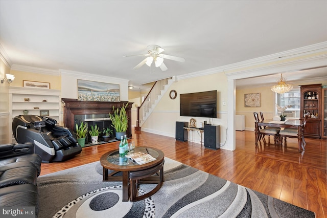 7200 Wayne Ave, Upper Darby, PA 19082 - living area with a fireplace, ornamental molding, a ceiling fan, a chandelier, and stairway