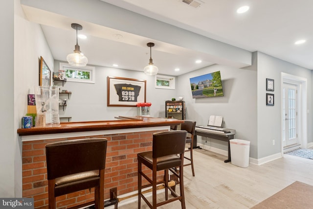 14520 Fairdale Rd, Silver Spring, MD 20905 - indoor dry bar with wood finished floors, recessed lighting, pendant lighting, baseboards, and healthy amount of natural light