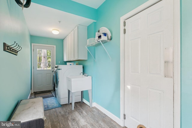 14520 Fairdale Rd, Silver Spring, MD 20905 - laundry room featuring cabinet space, wood finished floors, baseboards, and washer / dryer