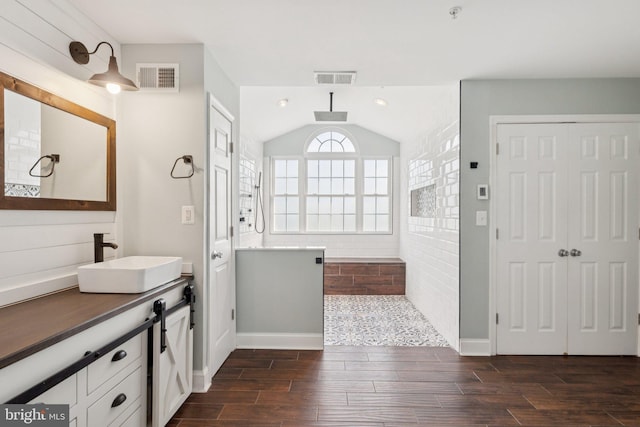 14520 Fairdale Rd, Silver Spring, MD 20905 - full bathroom with vanity, walk in shower, wood finished floors, lofted ceiling, and baseboards