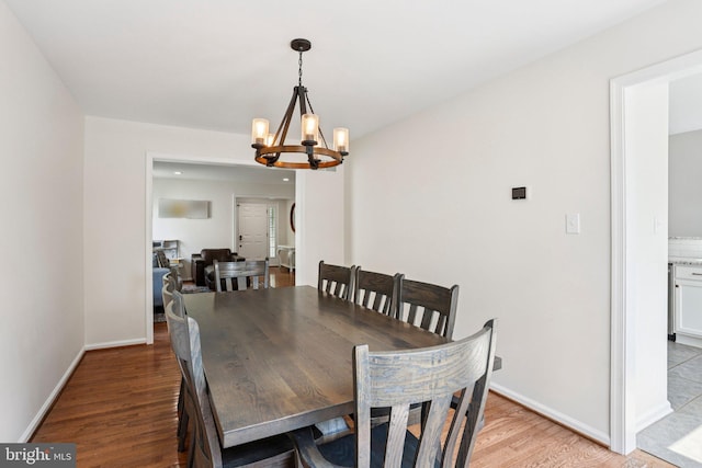 1112 Cornwallis Way, Collegeville, PA 19426 - dining space with a chandelier, light wood-style flooring, and baseboards