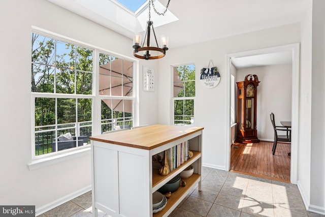 1112 Cornwallis Way, Collegeville, PA 19426 - dining space with a chandelier, a skylight, healthy amount of natural light, and baseboards