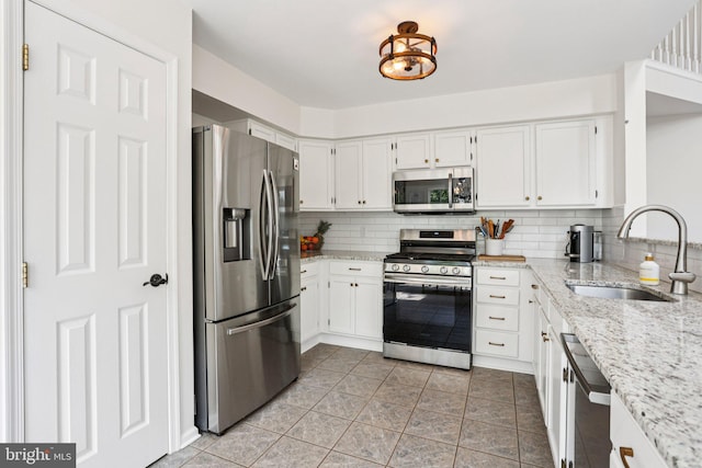 1112 Cornwallis Way, Collegeville, PA 19426 - kitchen featuring stainless steel appliances, a sink, tasteful backsplash, and white cabinets