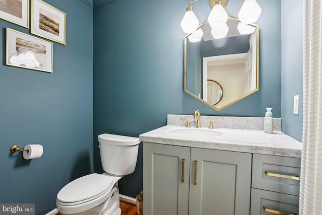 1112 Cornwallis Way, Collegeville, PA 19426 - bathroom featuring toilet, vanity, a chandelier, wood finished floors, and baseboards