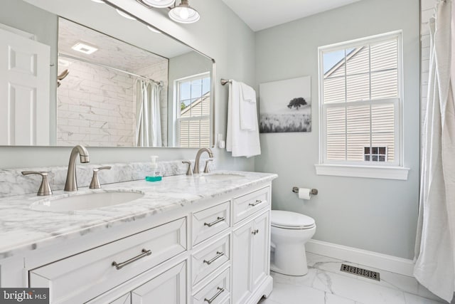 1112 Cornwallis Way, Collegeville, PA 19426 - bathroom featuring marble finish flooring, double vanity, toilet, and plenty of natural light