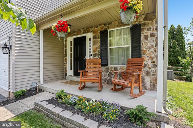 1112 Cornwallis Way, Collegeville, PA 19426 - property entrance with a porch, stone siding, and central air condition unit