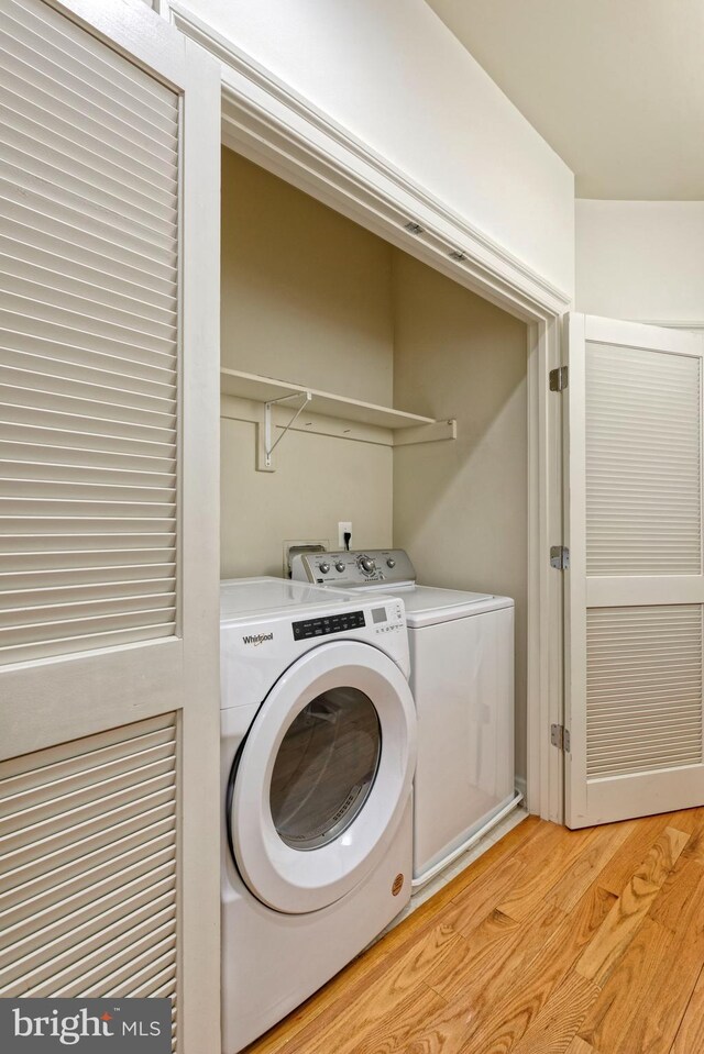 404 Oronoco St, Alexandria, VA 22314 - laundry area featuring washing machine and clothes dryer and light wood-style floors