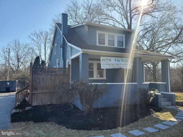 3004 Dekalb Pike, East Norriton, PA 19401 - view of side of home with a chimney, a porch, and roof with shingles