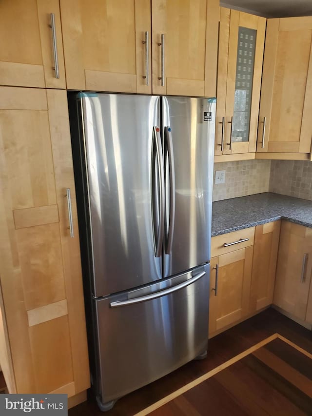 3004 Dekalb Pike, East Norriton, PA 19401 - kitchen with freestanding refrigerator, dark wood-style floors, glass insert cabinets, light brown cabinetry, and decorative backsplash