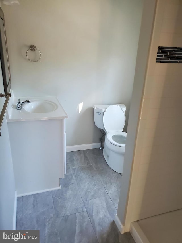 3004 Dekalb Pike, East Norriton, PA 19401 - full bathroom with vanity, toilet, baseboards, and tile patterned floors