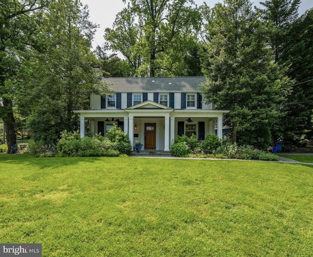 5914 Gloster Rd, Bethesda, MD 20816 - view of front of home with a porch, a front yard, and a chimney