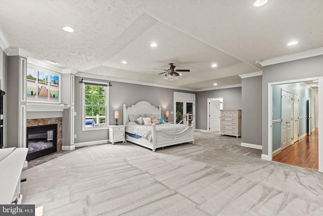 26471 N Sandgates Rd, Mechanicsville, MD 20659 - bedroom with carpet floors, crown molding, baseboards, recessed lighting, and a tile fireplace