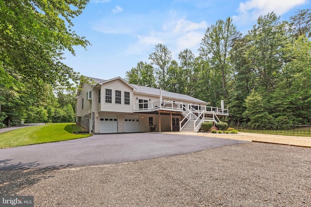 26471 N Sandgates Rd, Mechanicsville, MD 20659 - view of front facade featuring asphalt driveway, stairs, a garage, and a wooden deck
