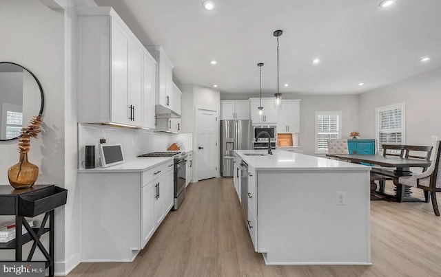 202 Grisham Rd, Stafford, VA 22554 - kitchen with stainless steel appliances, light wood-style floors, light countertops, and recessed lighting