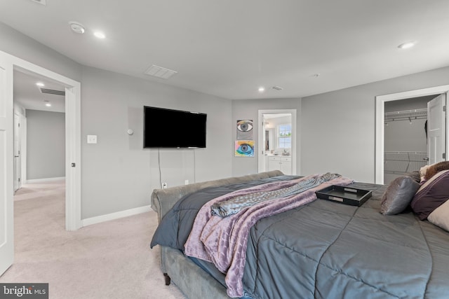 8798 Bancroft Dr, Waldorf, MD 20603 - bedroom with light carpet, baseboards, recessed lighting, a spacious closet, and ensuite bath