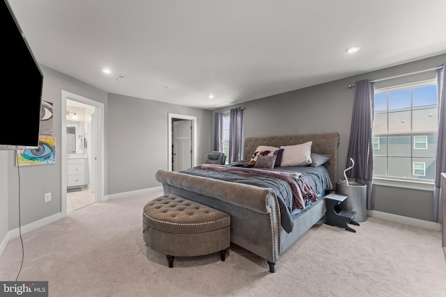 8798 Bancroft Dr, Waldorf, MD 20603 - bedroom featuring light colored carpet, baseboards, multiple windows, recessed lighting, and ensuite bathroom