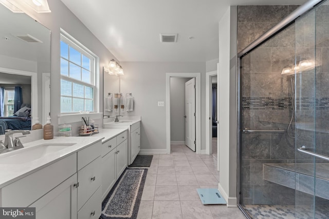 8798 Bancroft Dr, Waldorf, MD 20603 - bathroom with ensuite bathroom, double vanity, healthy amount of natural light, and a shower stall