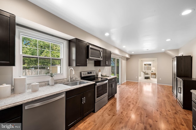 3011 Spark Ln, Bowie, MD 20715 - kitchen with stainless steel appliances, recessed lighting, light wood-type flooring, and light stone countertops