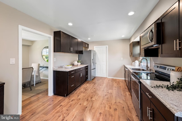 3011 Spark Ln, Bowie, MD 20715 - kitchen with appliances with stainless steel finishes, light wood-style floors, dark brown cabinetry, and recessed lighting