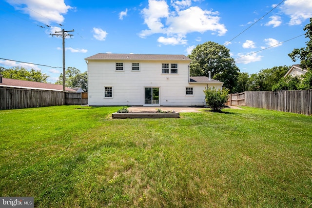 3011 Spark Ln, Bowie, MD 20715 - rear view of house with a fenced backyard