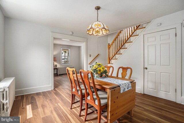 453 Old Elm St, Conshohocken, PA 19428 - dining space with radiator heating unit, wood finished floors, and stairs