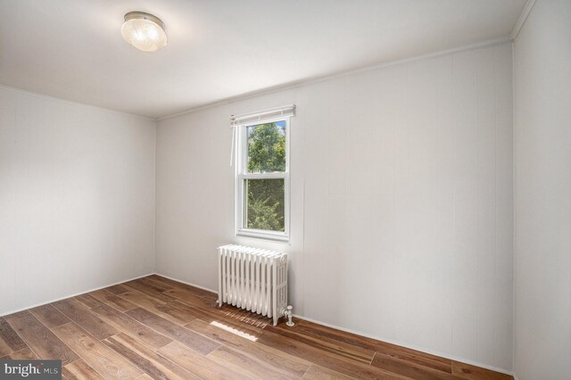 453 Old Elm St, Conshohocken, PA 19428 - spare room with radiator heating unit, ornamental molding, and wood finished floors