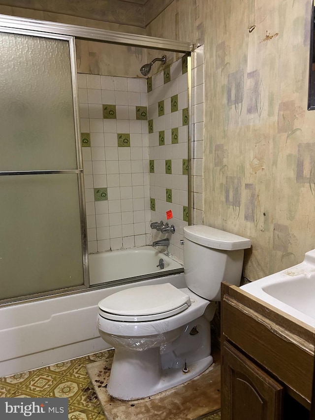 7303 Leona St, District Heights, MD 20747 - bathroom featuring vanity, toilet, and combined bath / shower with glass door