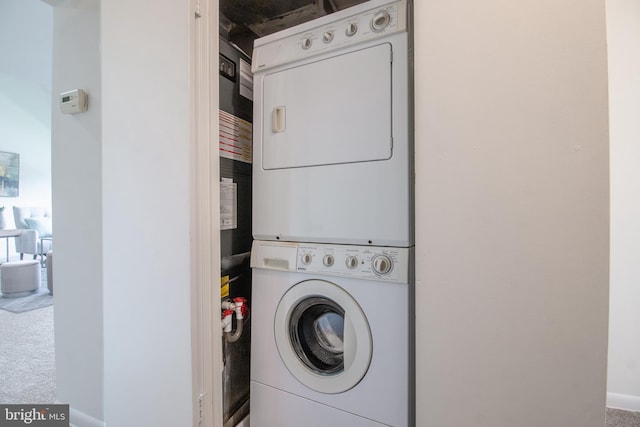 11510 Bucknell Dr Unit 201, Silver Spring, MD 20902 - laundry area featuring stacked washer and clothes dryer and carpet