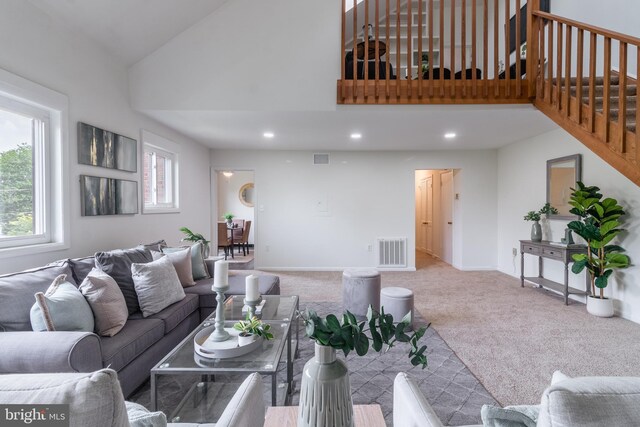 11510 Bucknell Dr Unit 201, Silver Spring, MD 20902 - carpeted living room featuring high vaulted ceiling, stairway, and recessed lighting