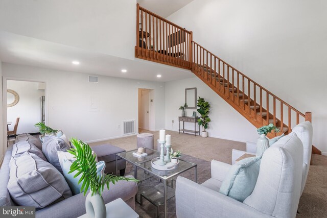 11510 Bucknell Dr Unit 201, Silver Spring, MD 20902 - living room featuring carpet flooring, stairs, a towering ceiling, and recessed lighting