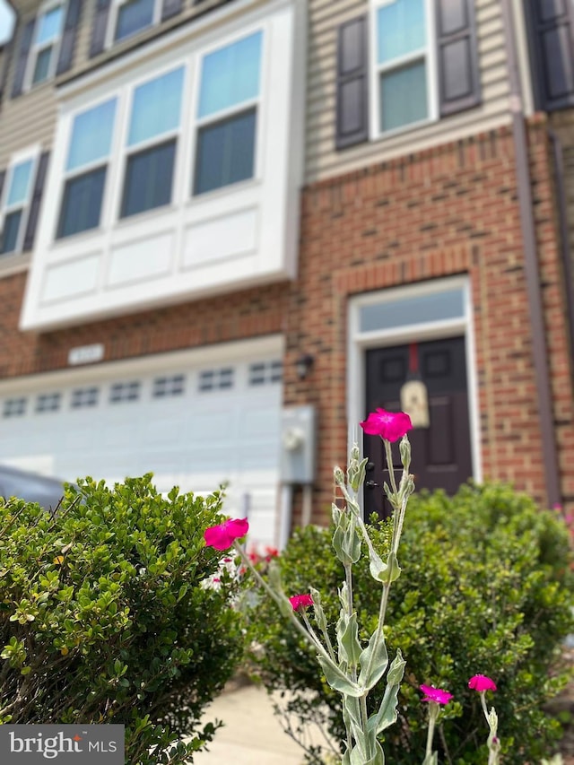 9608 Julia Ln, Owings Mills, MD 21117 - view of front of house with brick siding and a garage