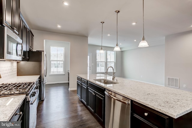 9608 Julia Ln, Owings Mills, MD 21117 - kitchen featuring stainless steel appliances, a sink, dark wood-style flooring, light stone counters, and recessed lighting