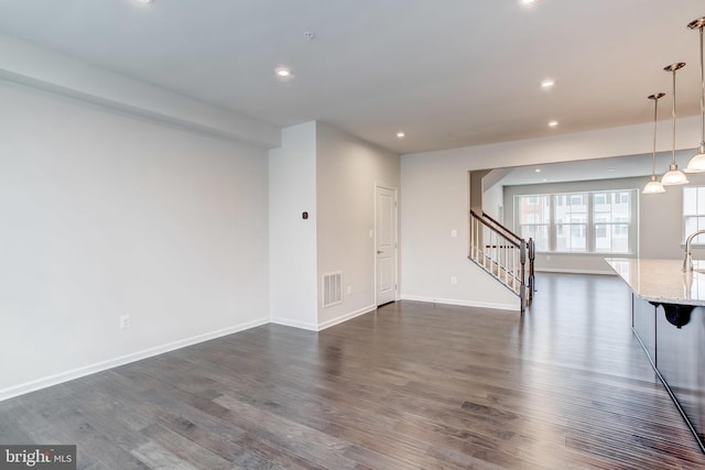 9608 Julia Ln, Owings Mills, MD 21117 - spare room with stairway, dark wood-type flooring, recessed lighting, and baseboards