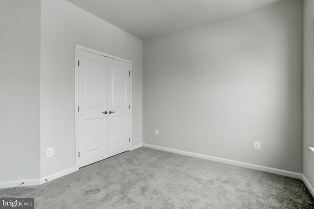 9608 Julia Ln, Owings Mills, MD 21117 - unfurnished bedroom with carpet flooring, baseboards, and a closet