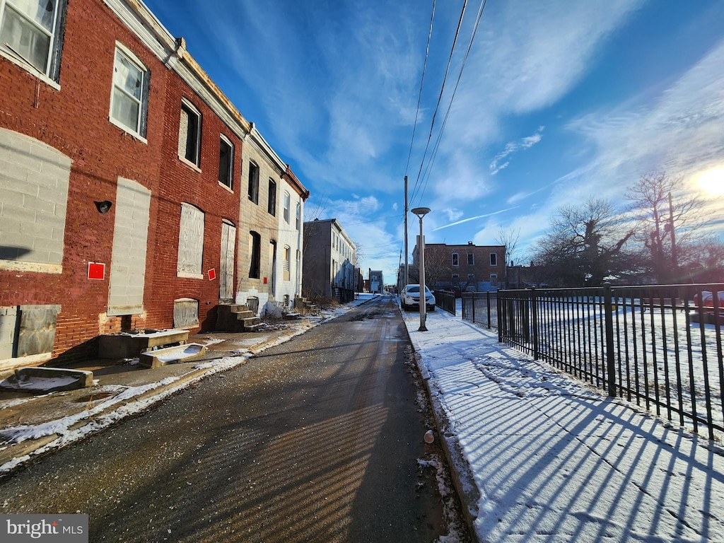 2132 Boyd St, Baltimore, MD 21223 - view of asphalt road featuring entry steps, street lights, and a residential view