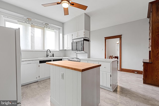 28 N Wakefield, Jeffersonville, PA 19403 - kitchen featuring white appliances, a sink, butcher block countertops, a ceiling fan, and a peninsula