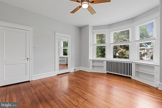28 N Wakefield, Jeffersonville, PA 19403 - spare room featuring radiator heating unit, hardwood / wood-style flooring, ceiling fan, and baseboards