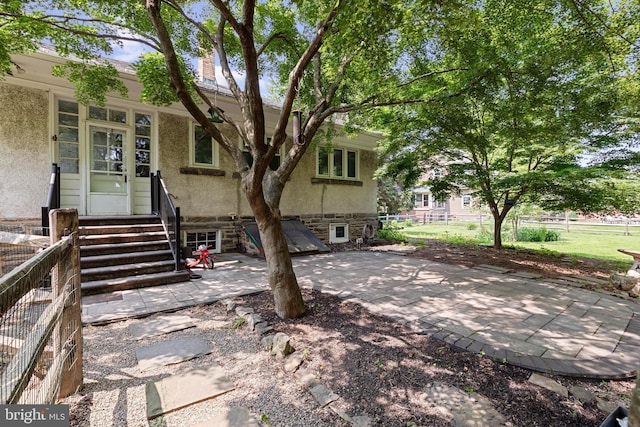 28 N Wakefield, Jeffersonville, PA 19403 - view of front facade featuring a patio, stucco siding, and entry steps