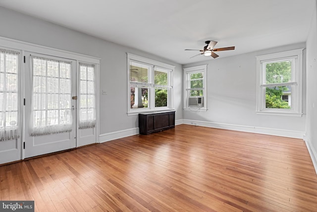 28 N Wakefield, Jeffersonville, PA 19403 - unfurnished living room featuring radiator heating unit, ceiling fan, hardwood / wood-style flooring, baseboards, and cooling unit