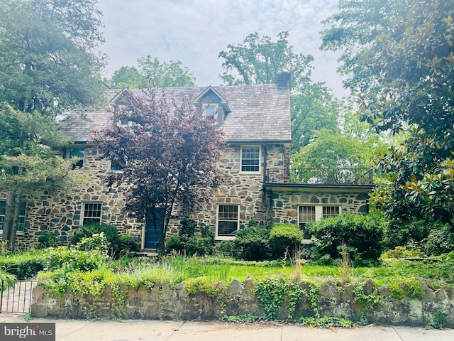 125 Edgewood Rd, Baltimore, MD 21286 - tudor-style house featuring stone siding, a chimney, and a high end roof